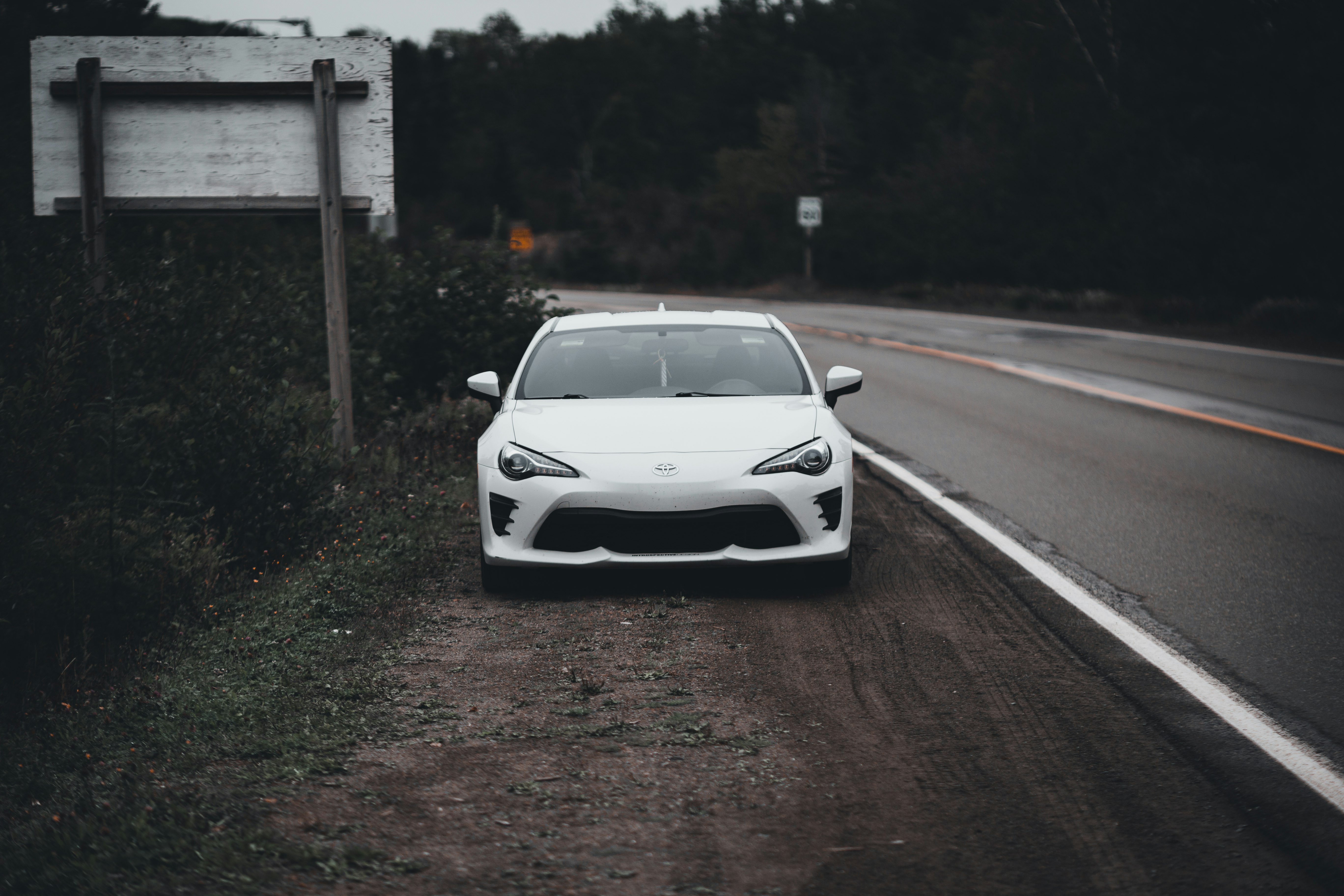 white car on road during daytime